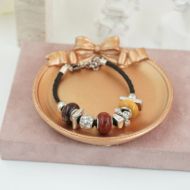 Pulseras trenzada negra con cuentas Vie Or 12 uds - I35